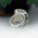back view, cushion black onyx gemstone bezel set bead wire and stamped cutout wire accent on tapered wide band